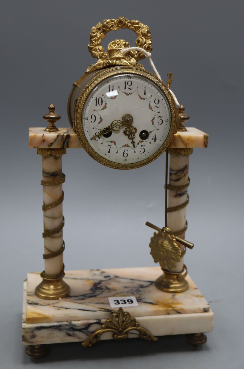 A French peach marble and gilt pillar clock, height 38cm